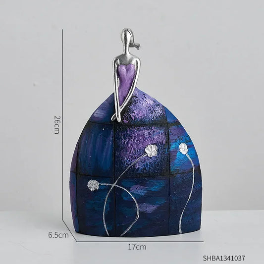Statue of a woman with a purple/blue skirt 1