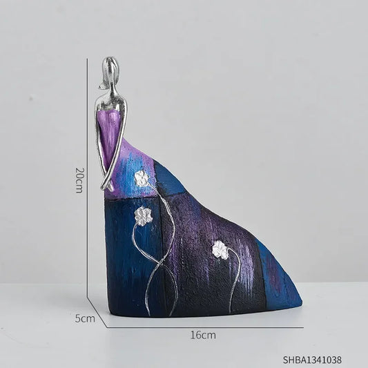 Statue of a woman in a blue/purple skirt